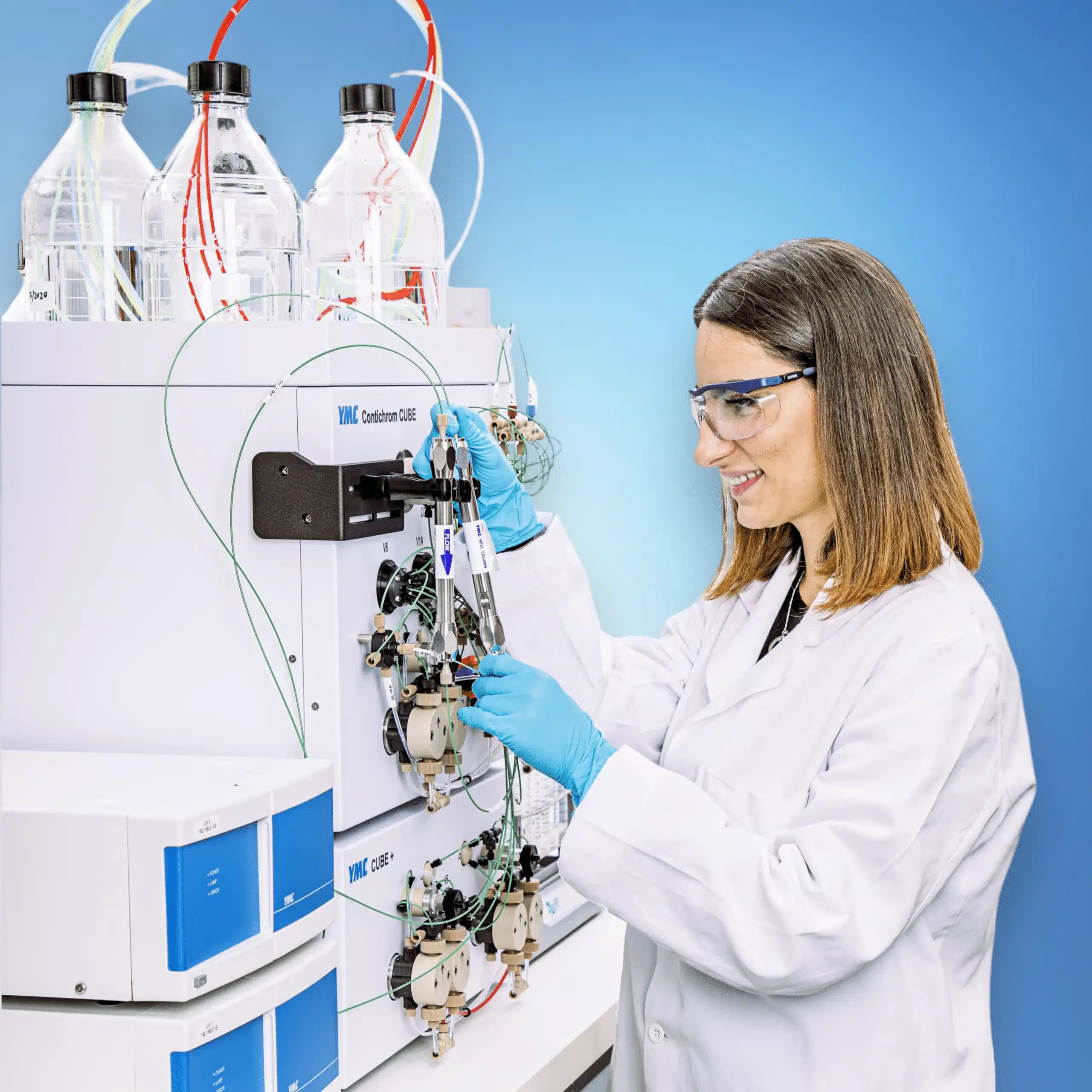 Scientist operating a Contichrom CUBE chromatography system